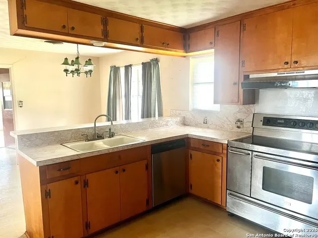 a kitchen with a sink and cabinets