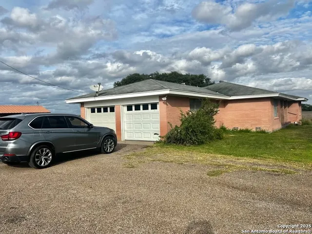 a view of a car in front of house