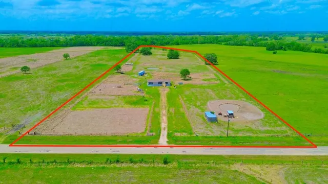 a view of a golf course with a big yard