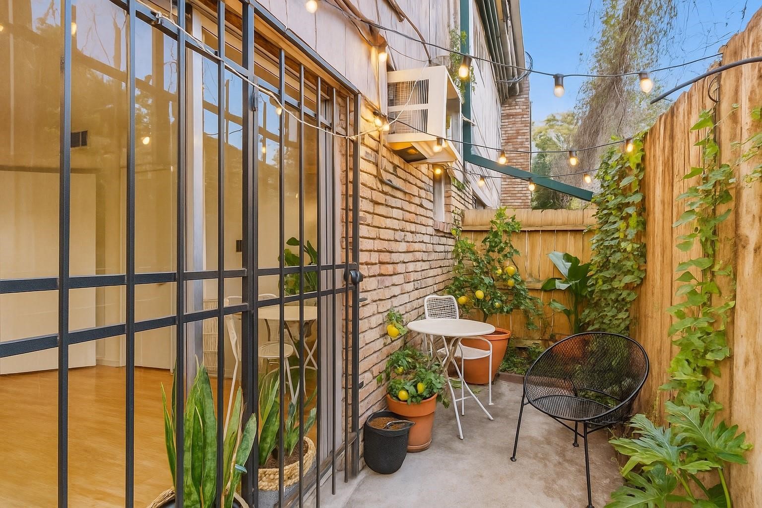 1849 Marshall Street, Unit 9 Houston, TX 77098 - Photo 16 of 24 a view of an chairs and table in the balcony