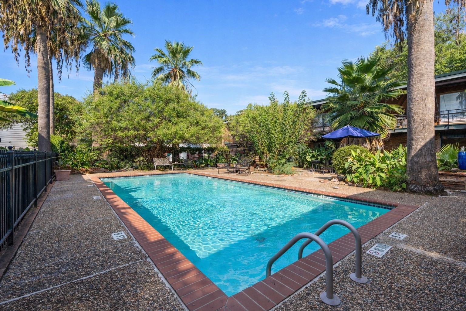 1849 Marshall Street, Unit 9 Houston, TX 77098 - Photo 2 of 24 a view of a backyard with plants and a patio