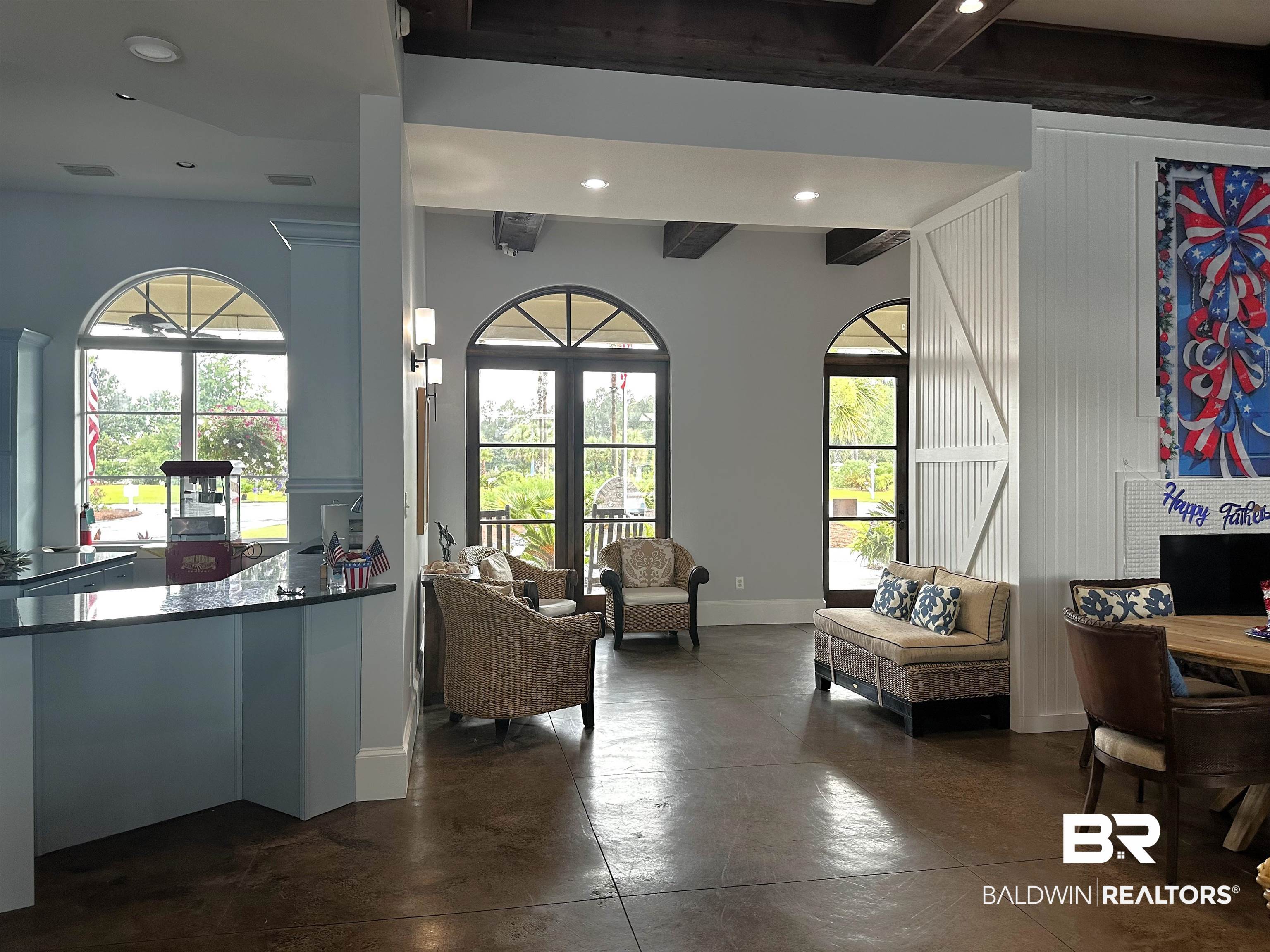 28238 Migratory Way Elberta, AL 36530 - Photo 58 of 58 Living area featuring recessed lighting, beam ceiling, and finished concrete flooring
