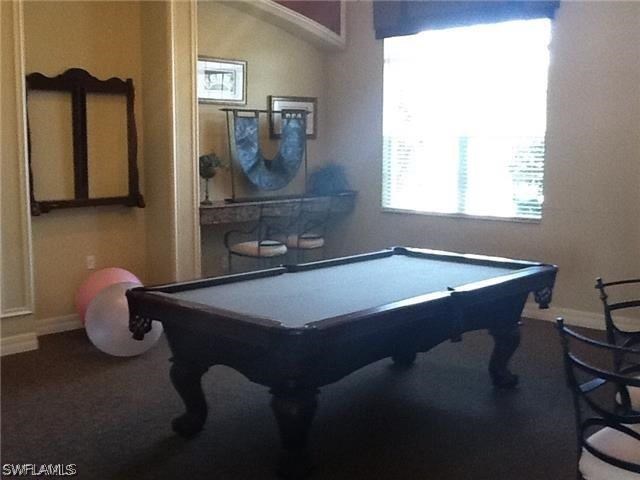 11711 Eros Road Lehigh Acres, FL 33971 - Photo 12 of 13 a room with table chairs and window