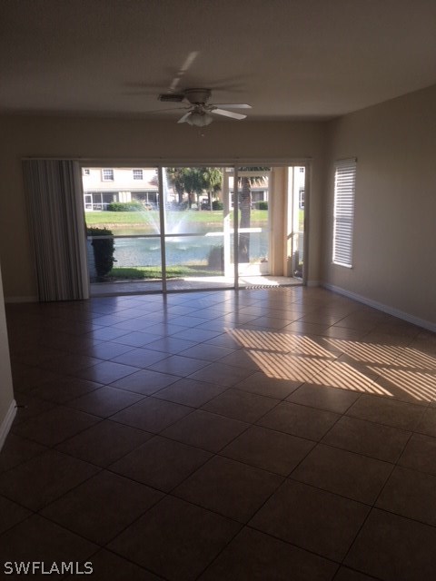 11711 Eros Road Lehigh Acres, FL 33971 - Photo 2 of 13 a view of empty room with wooden floor