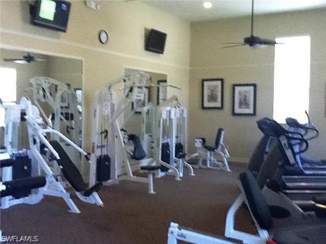 11711 Eros Road Lehigh Acres, FL 33971 - Photo 7 of 13 a view of a room with gym equipment