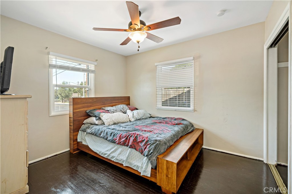 6006 Colonial Drive Riverside, CA 92506 - Photo 16 of 36 a bedroom with a bed and a ceiling fan