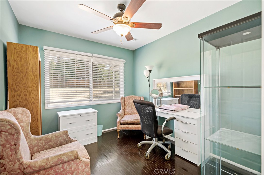 6006 Colonial Drive Riverside, CA 92506 - Photo 17 of 36 a view of a workspace with furniture and a window