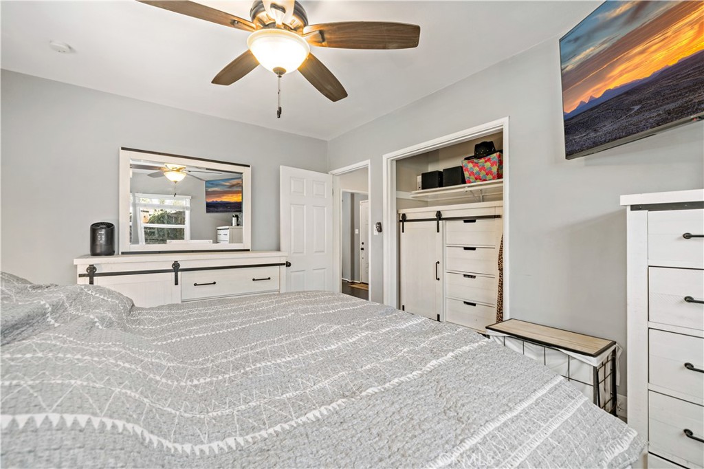 6006 Colonial Drive Riverside, CA 92506 - Photo 19 of 36 a bed room with a bed and a flat tv screen