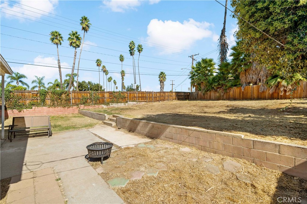 6006 Colonial Drive Riverside, CA 92506 - Photo 24 of 36 a view of a swimming pool with a lounge chairs