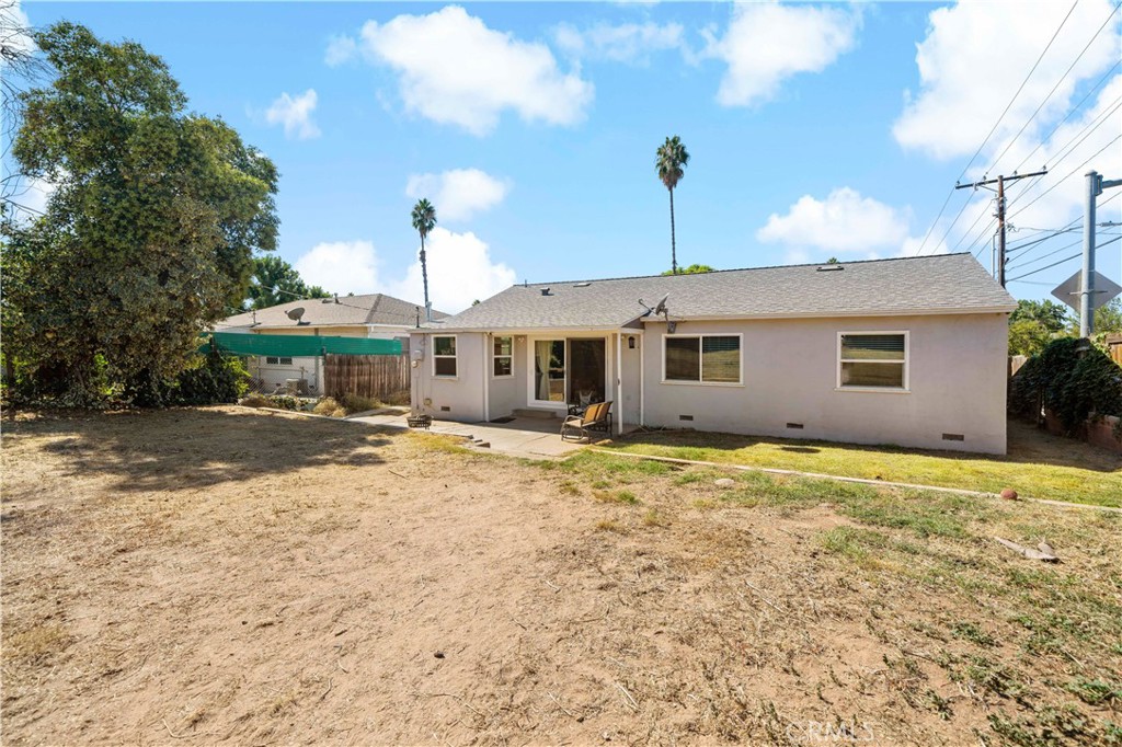 6006 Colonial Drive Riverside, CA 92506 - Photo 26 of 36 a front view of a house with a yard and garage