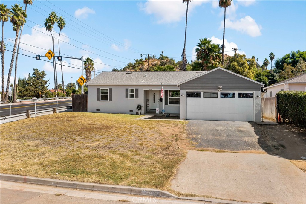 6006 Colonial Drive Riverside, CA 92506 - Photo 32 of 36 a front view of a house with a garden