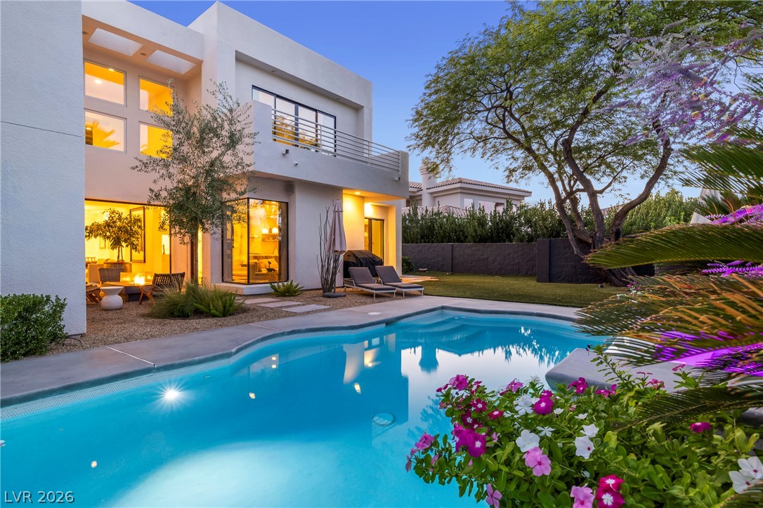 2000 Grouse Street Las Vegas, NV 89134 - Photo 61 of 89 An inviting private pool and verdant garden complement this modern residence's sleek lines.