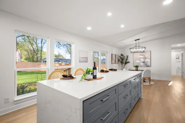 a view of a kitchen sink and natural light