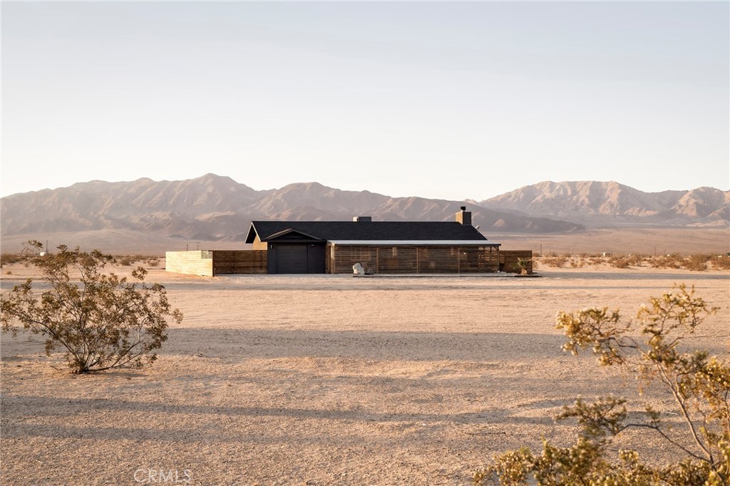 a view of a house with a mountain