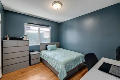 a bedroom with a bed and window