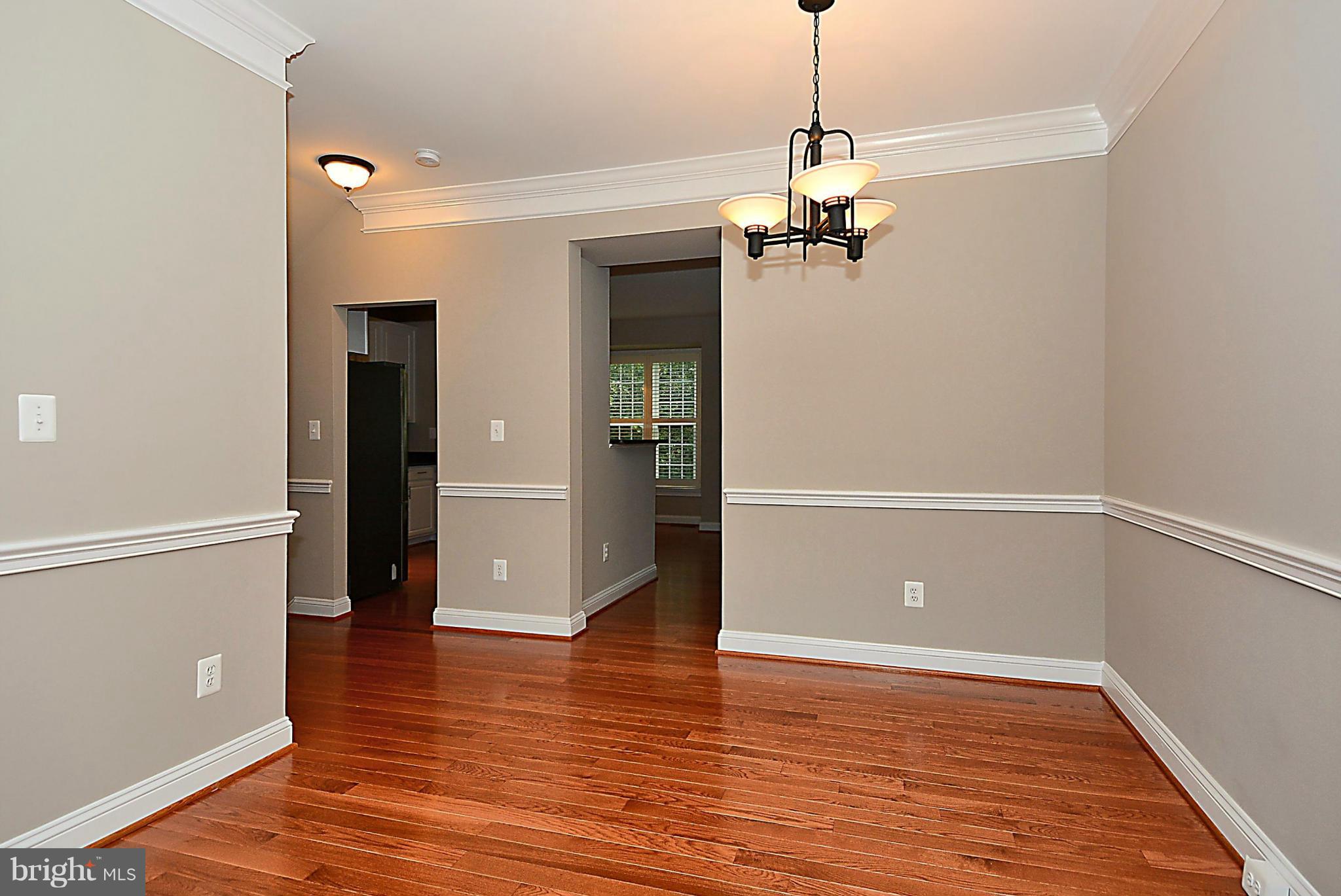 11420 Summer House Court Reston, VA 20194 - Photo 6 of 30 Dining Room, Chair Railing, Crown Molding