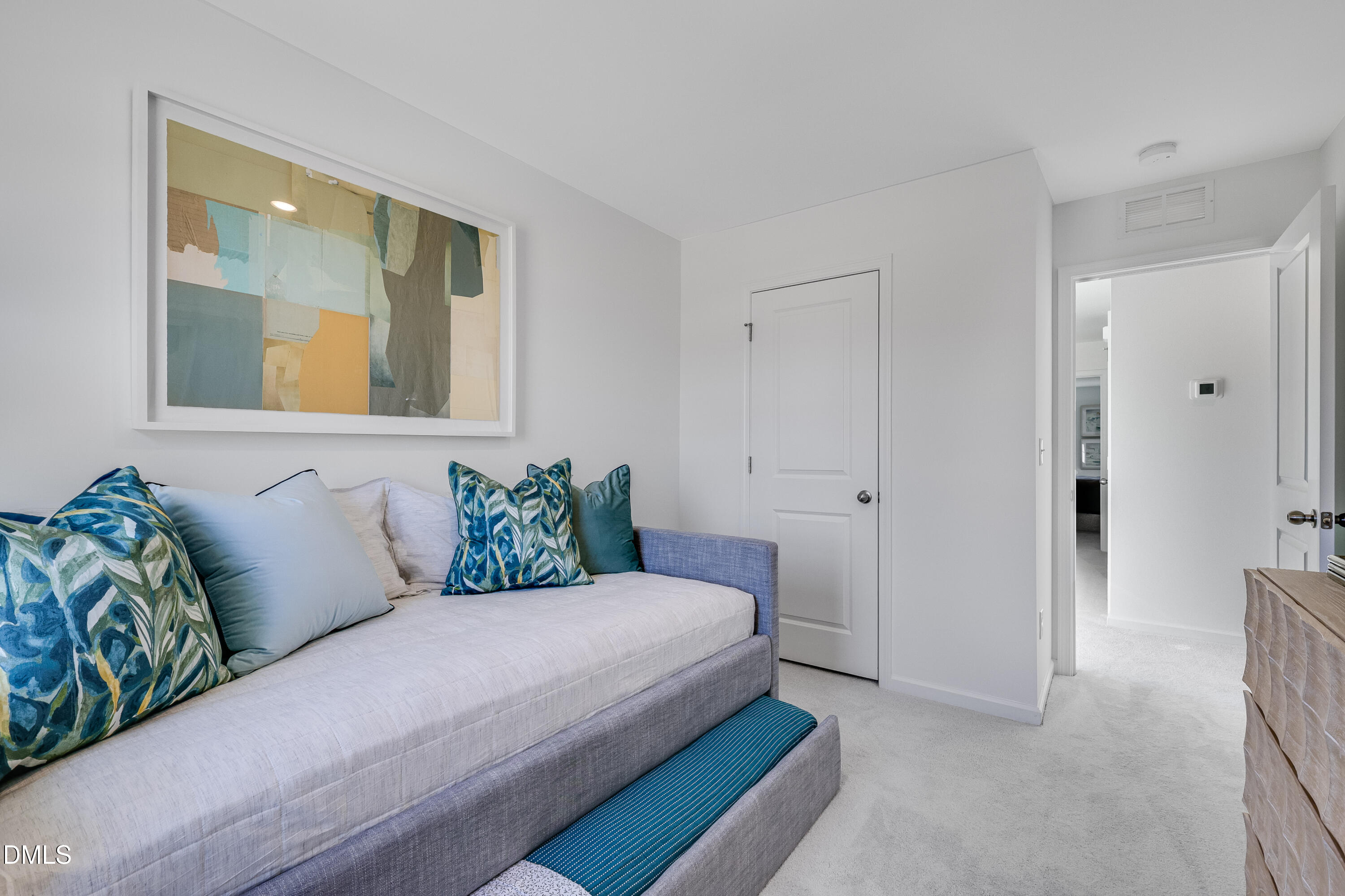 2428 Small Br Trail, Unit 10 Raleigh, NC 27610 - Photo 18 of 26 a bedroom with a bed and painting on the wall