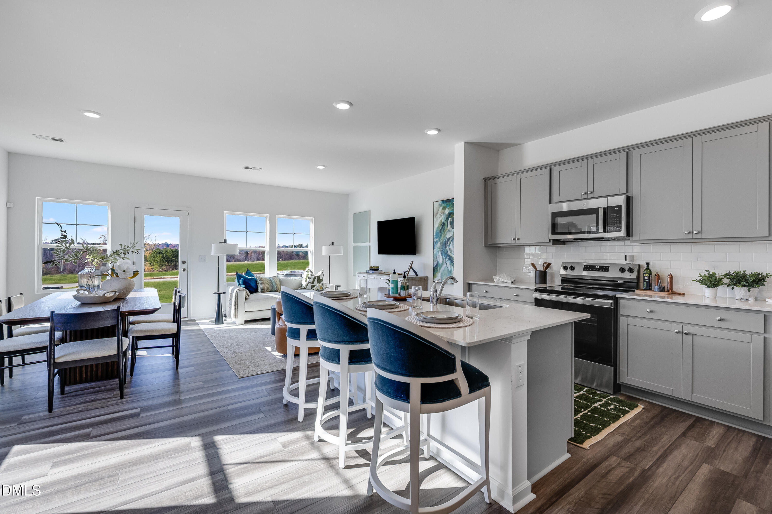 2428 Small Br Trail, Unit 10 Raleigh, NC 27610 - Photo 5 of 26 a view of kitchen with sink dining table and chairs