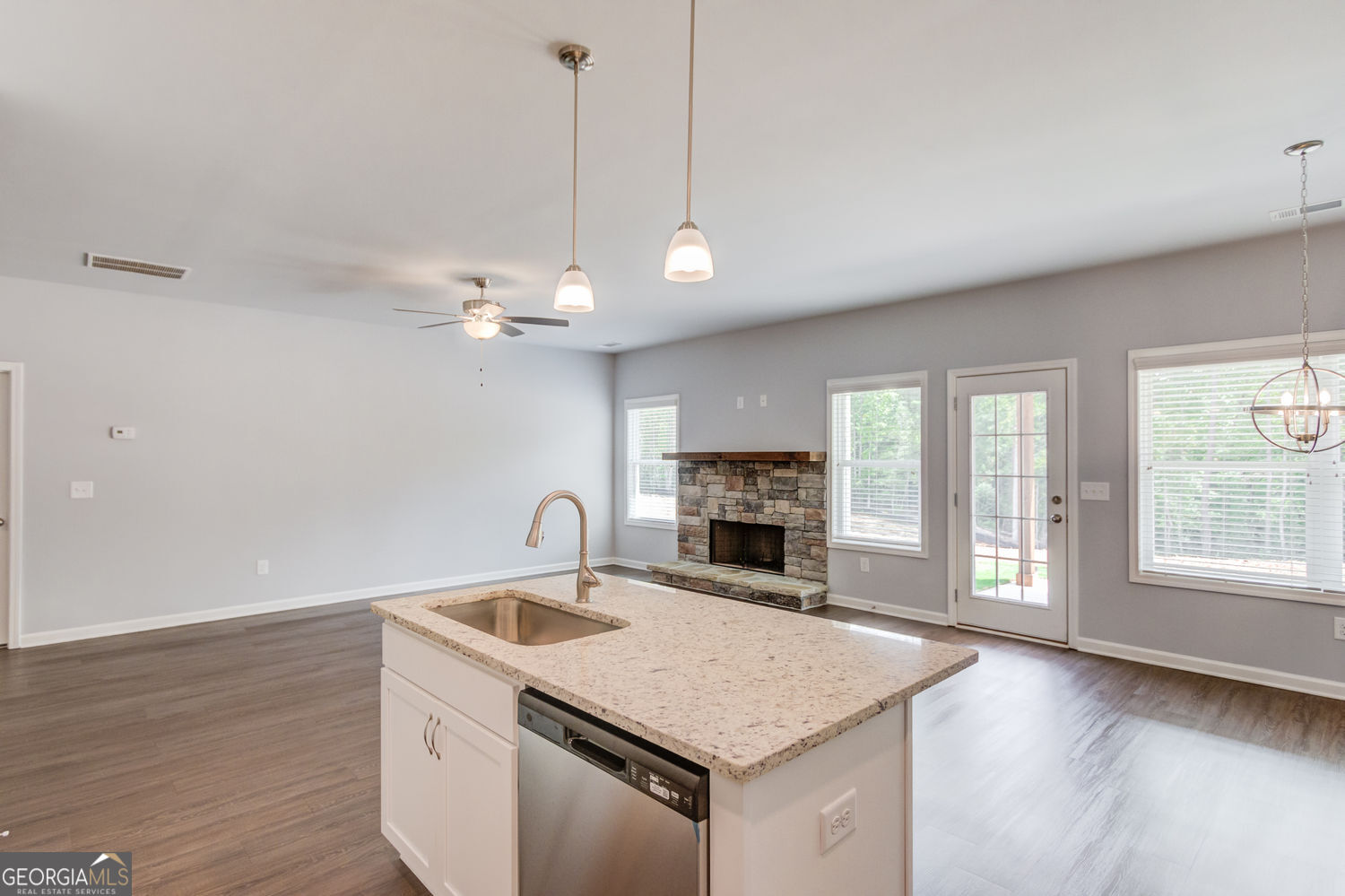 0 Harvest Church Road Clarkesville, GA 30523 - Photo 18 of 38 a kitchen with a stove a sink a chandelier and wooden floor