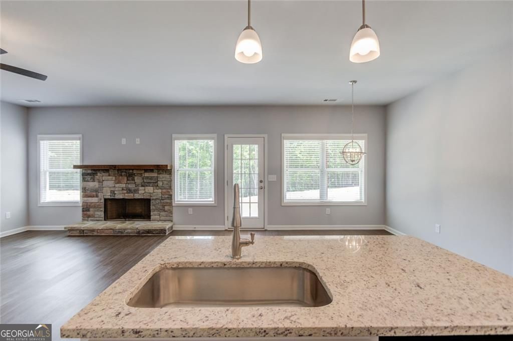 0 Harvest Church Road Clarkesville, GA 30523 - Photo 19 of 38 a kitchen with a window a sink and a fireplace