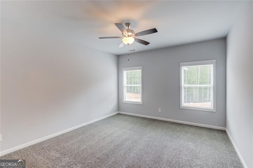 0 Harvest Church Road Clarkesville, GA 30523 - Photo 20 of 38 an empty room with a window and a fan
