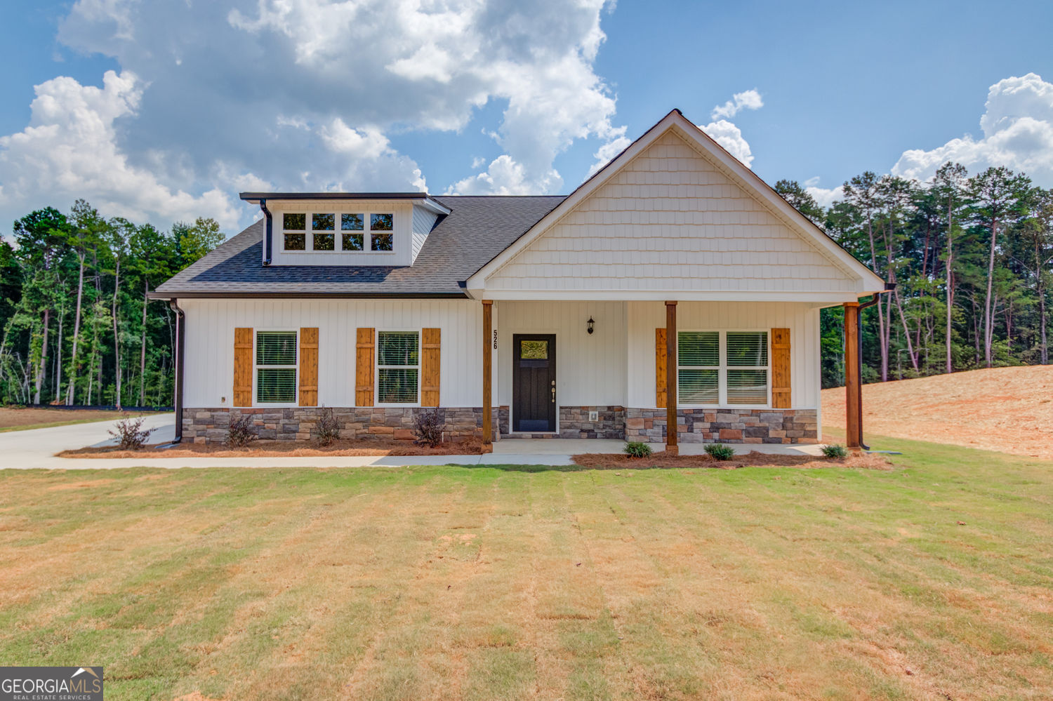0 Harvest Church Road Clarkesville, GA 30523 - Photo 2 of 38 a front view of a house with a yard outdoor seating and garage