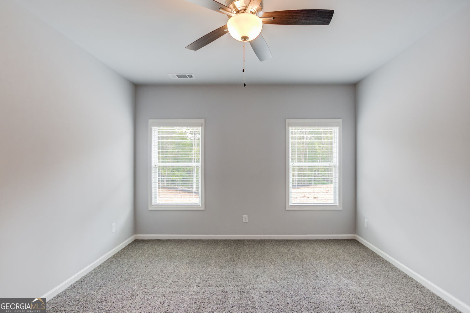 0 Harvest Church Road Clarkesville, GA 30523 - Photo 21 of 38 an empty room with chandelier fan and windows