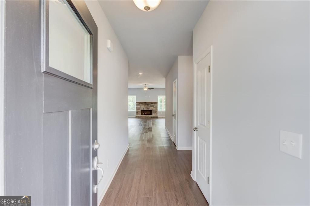 0 Harvest Church Road Clarkesville, GA 30523 - Photo 6 of 38 a view of a hallway with wooden floor and a bathroom