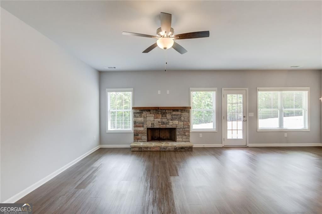 0 Harvest Church Road Clarkesville, GA 30523 - Photo 8 of 38 an empty room with wooden floor fireplace and windows