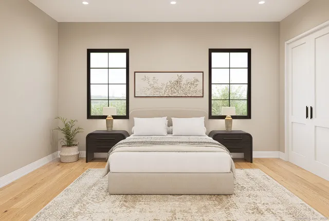 a bedroom with a large bed and a window