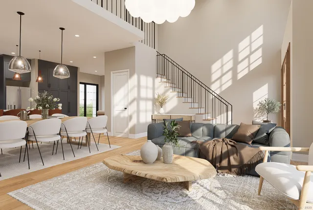 a living room with lots of furniture and a wooden floor