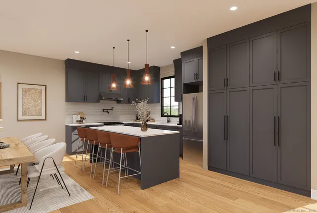 a kitchen with a table and chairs