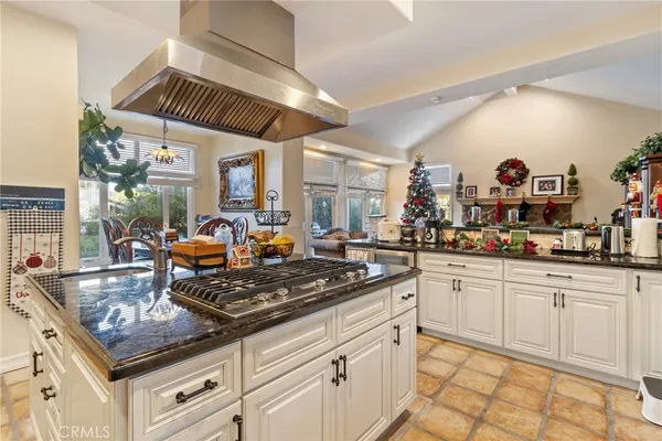 a kitchen with stainless steel appliances a stove a sink and a refrigerator