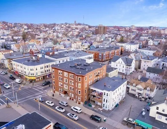 an aerial view of residential houses with outdoor space