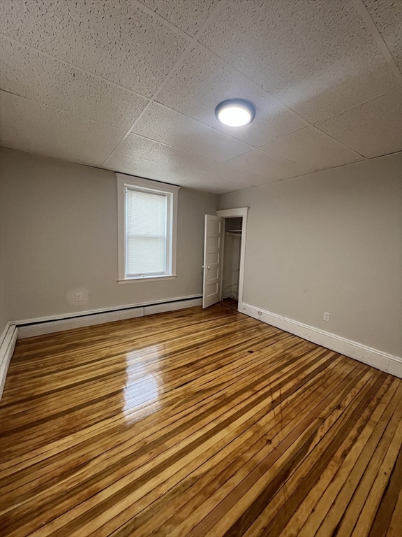 526 Western Avenue, Unit 3 Lynn, MA 01904 - Photo 7 of 9 a view of a room with wooden floor and window