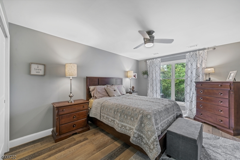 323 Sparrow Court Three Bridges, NJ 08887 - Photo 11 of 20 a bedroom with a bed and wooden floor