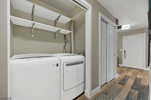 a view of storage and utility room with washer and dryer