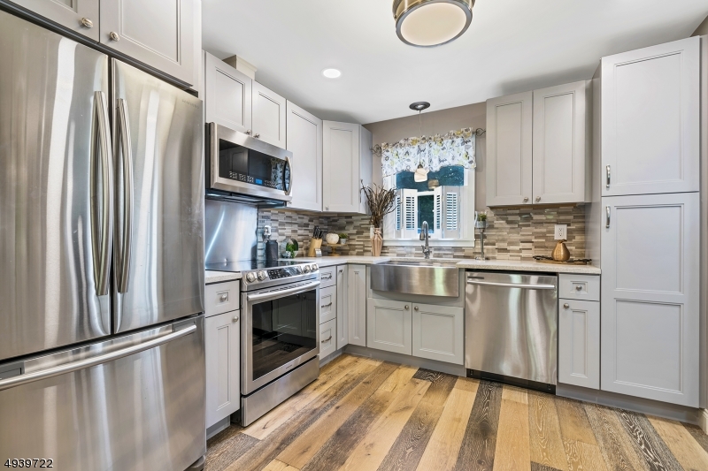 323 Sparrow Court Three Bridges, NJ 08887 - Photo 2 of 20 a kitchen with stainless steel appliances a refrigerator sink and microwave