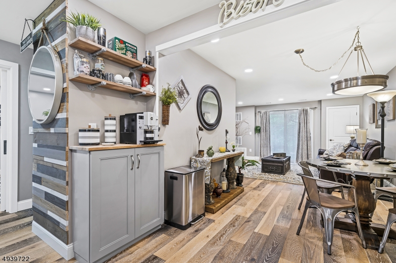 323 Sparrow Court Three Bridges, NJ 08887 - Photo 3 of 20 a kitchen with stainless steel appliances granite countertop a refrigerator a stove and white cabinets with wooden floor