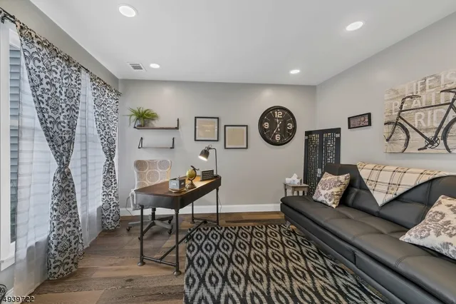 a living room with furniture and a rug