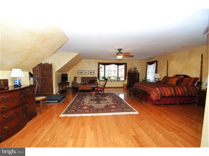 158 North Post Road Princeton Junction, NJ 08550 - Photo 14 of 23 a living room with furniture a rug and a flat screen tv