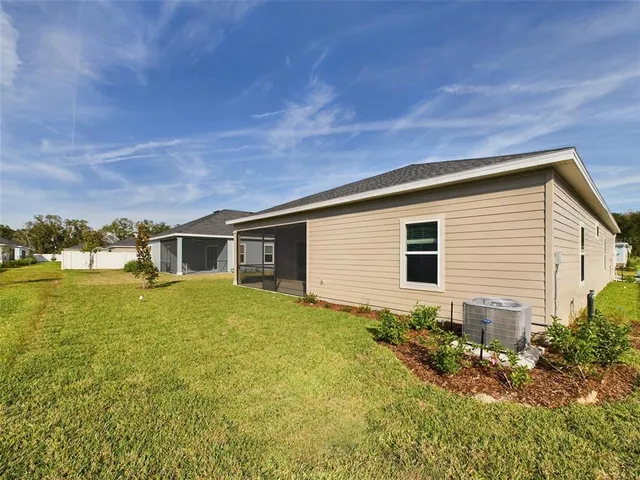 a front view of house with yard and trees