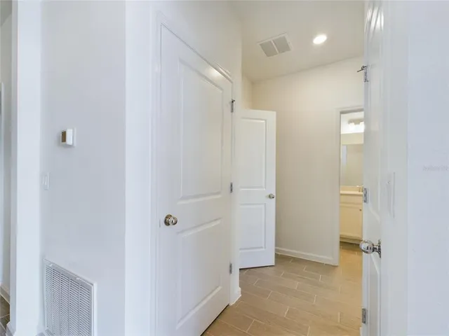 a view of a hallway with closet area