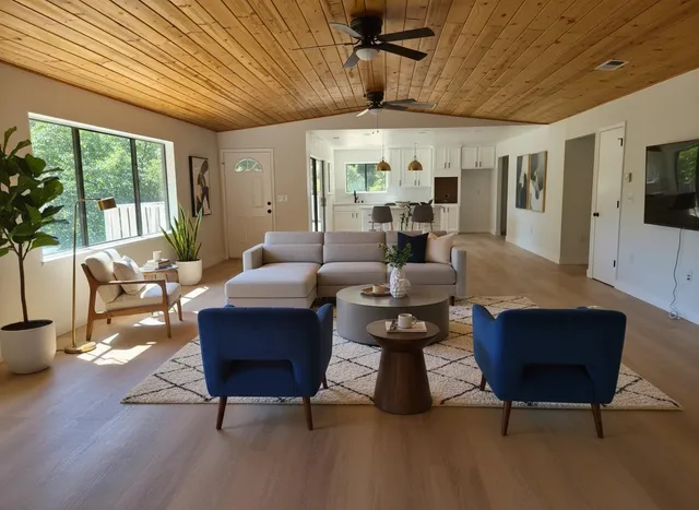 a living room with furniture and a large window