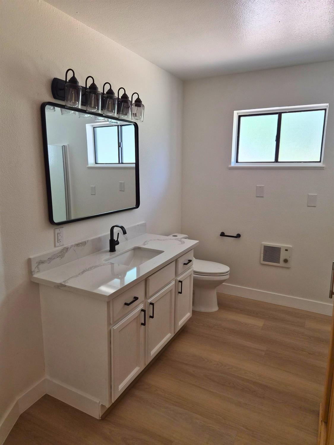 21640 Clute Canyon Road Volcano, CA 95689 - Photo 13 of 44 a bathroom with a toilet sink and mirror