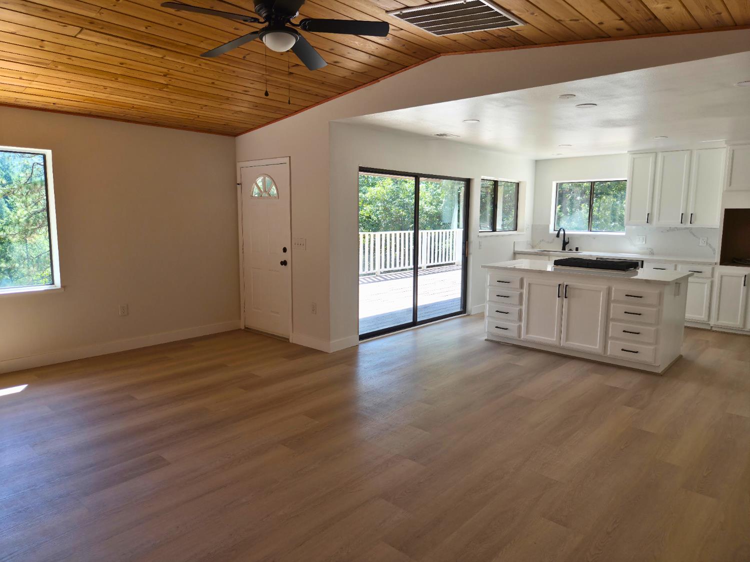 21640 Clute Canyon Road Volcano, CA 95689 - Photo 14 of 44 a large kitchen with cabinets wooden floor and a sink