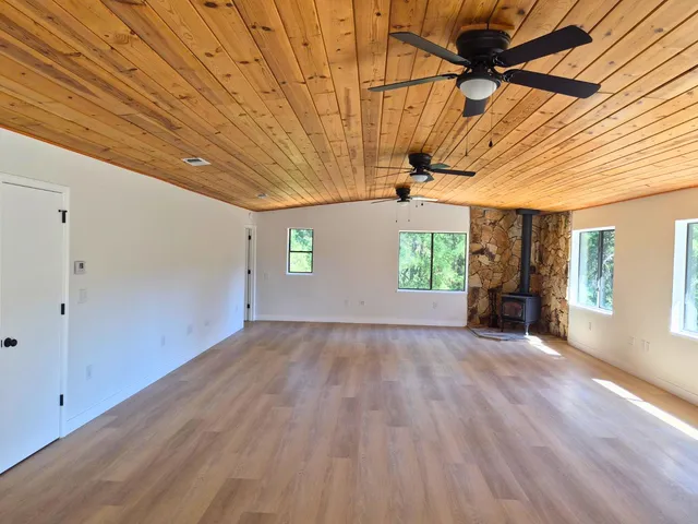 a view of a dining room with furniture and window