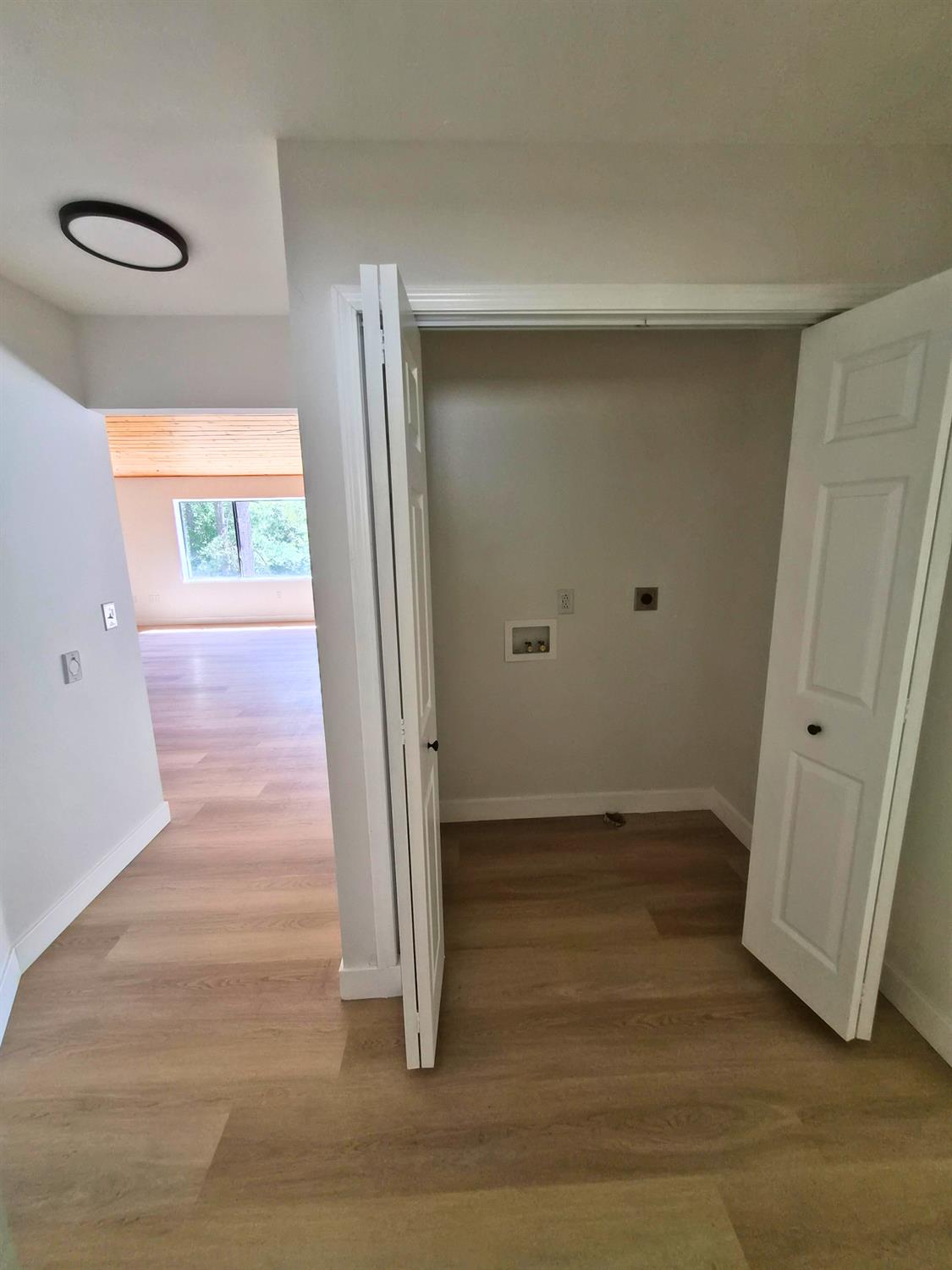21640 Clute Canyon Road Volcano, CA 95689 - Photo 18 of 44 a view of empty room with wooden floor and window