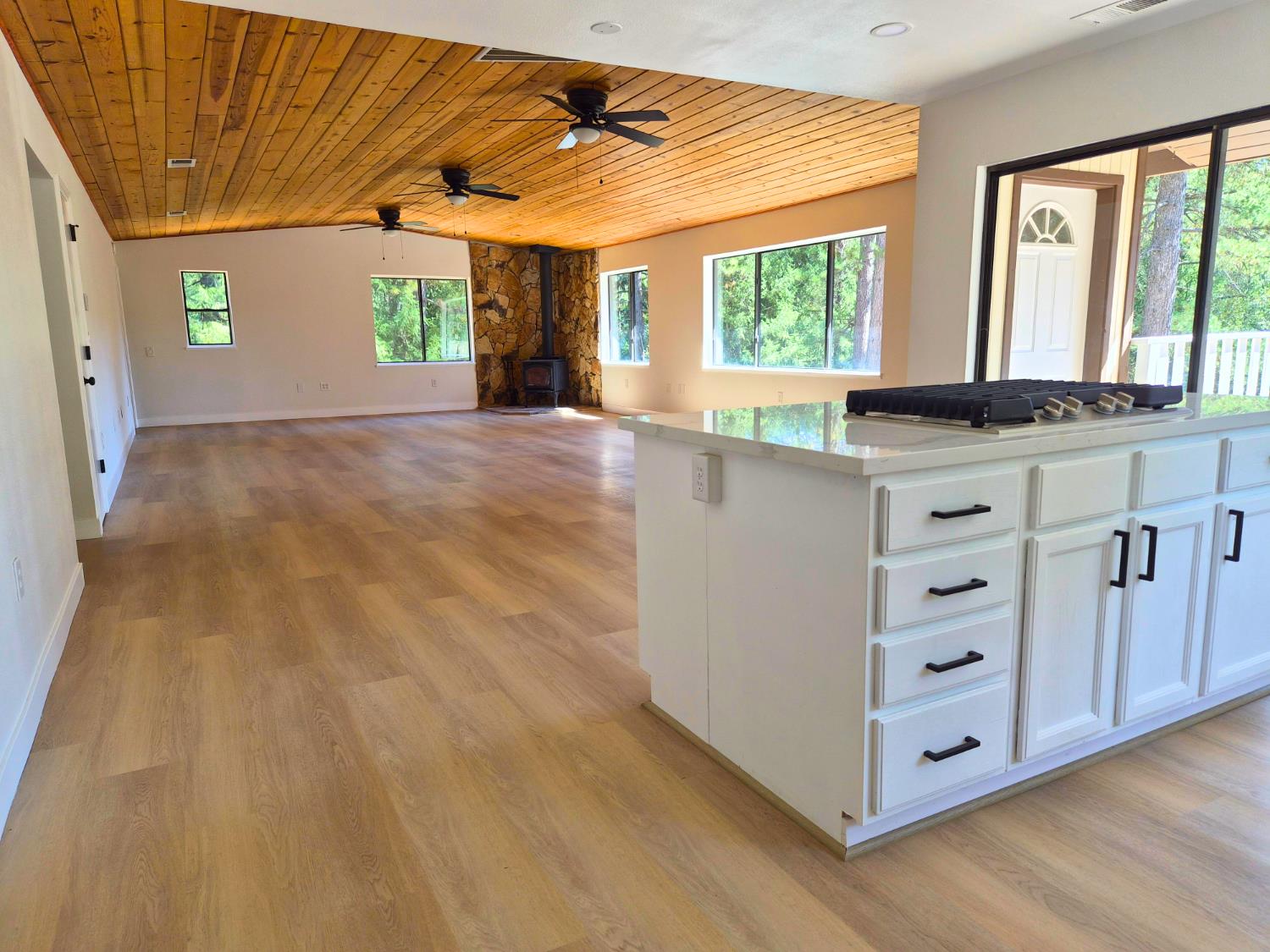 21640 Clute Canyon Road Volcano, CA 95689 - Photo 43 of 44 a view of kitchen with wooden floor and windows
