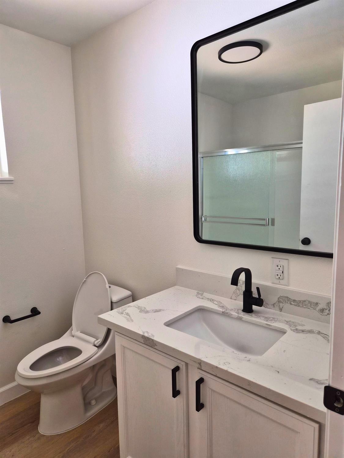 21640 Clute Canyon Road Volcano, CA 95689 - Photo 19 of 44 a bathroom with a toilet sink and mirror